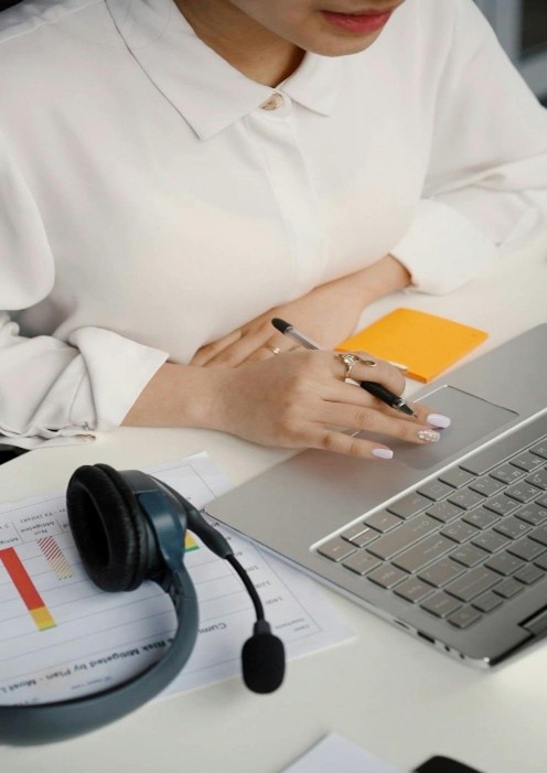 A person working on a computer AI-generated content may be incorrect.